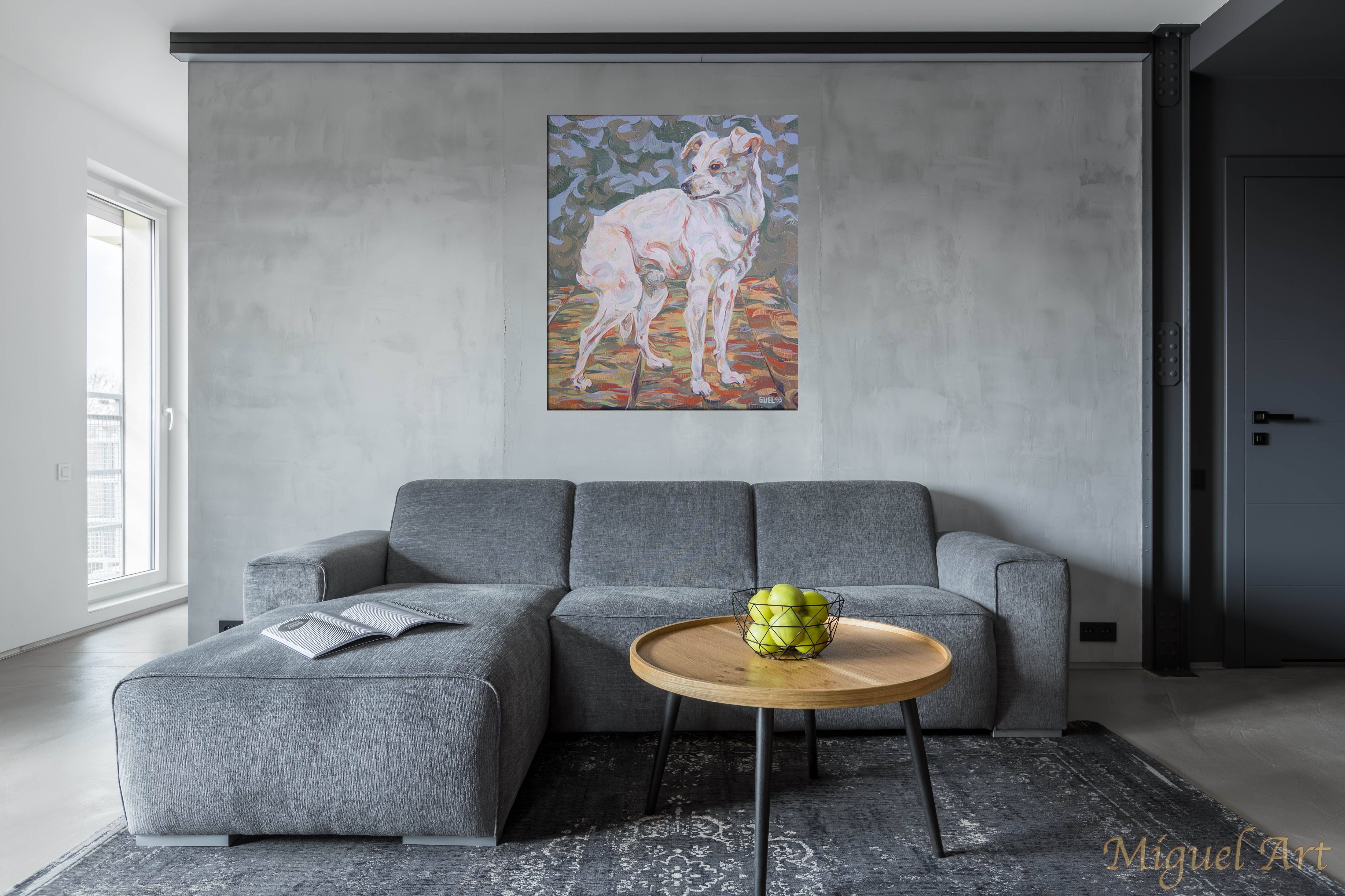 Painting of Toy displayed on the wall above a grey couch